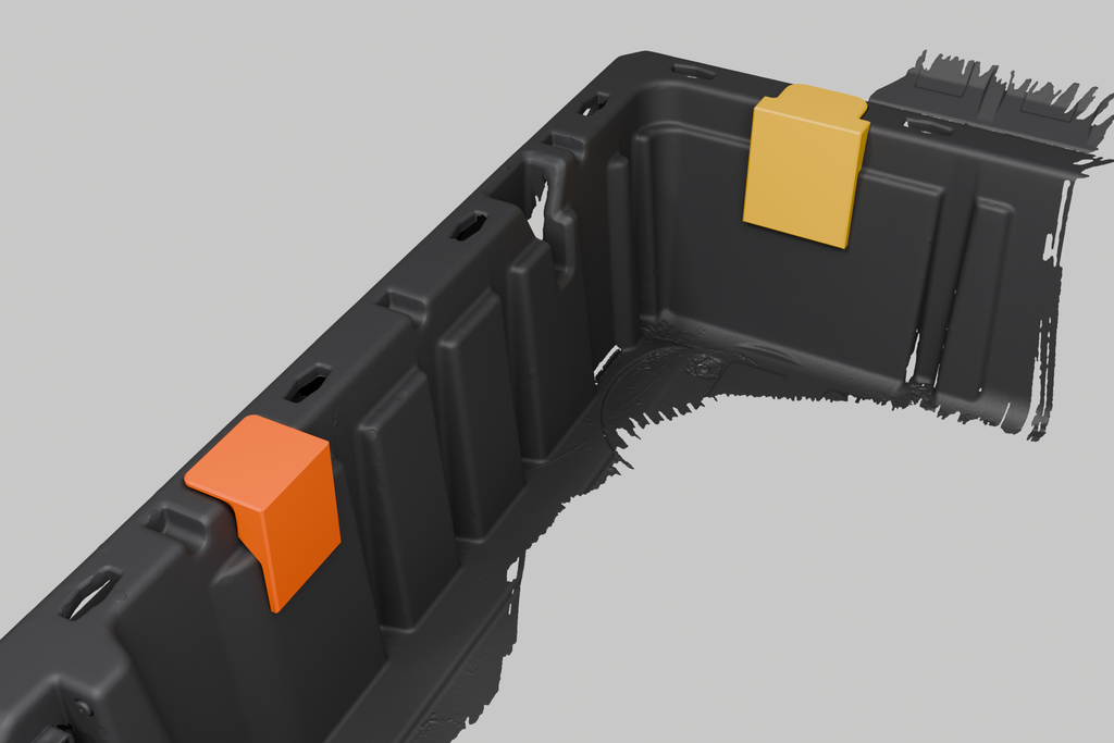 Dump bed mounting blocks installed in a Can-Am Defender bed